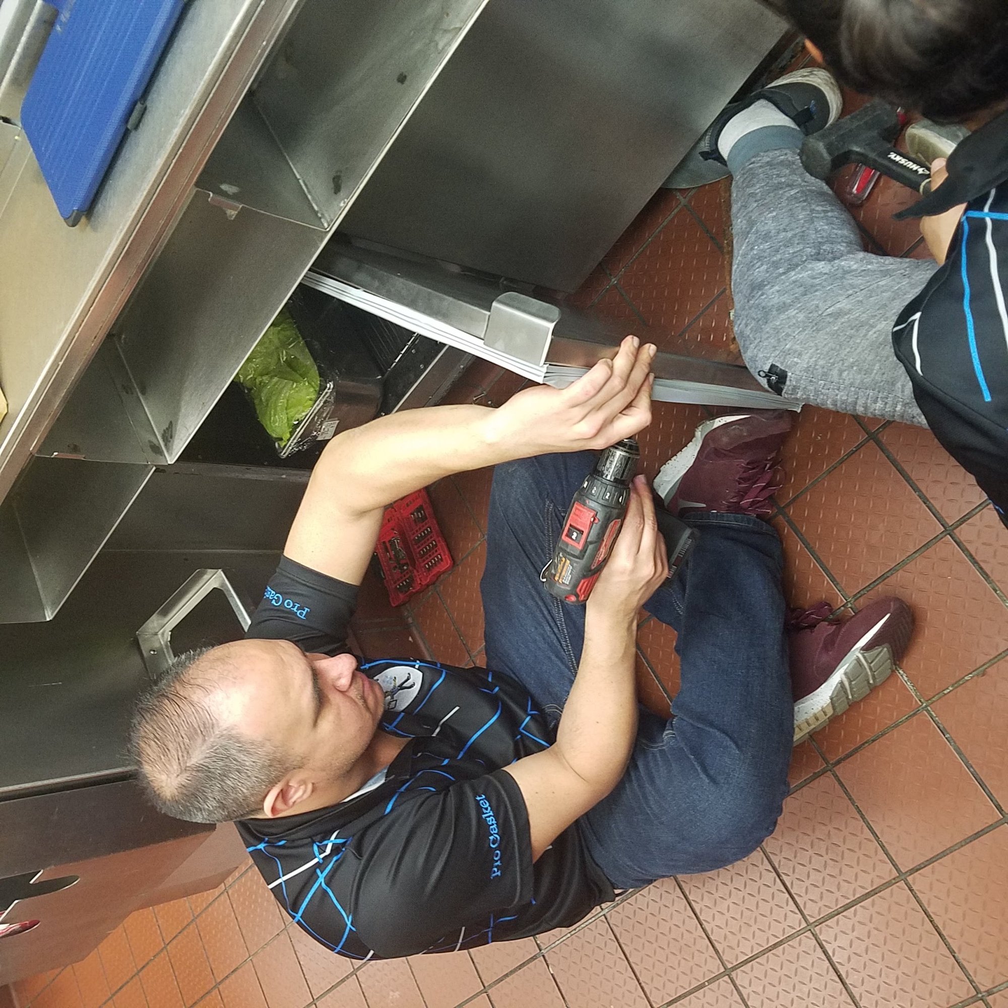 A Pro Gasket Group technician installing a gasket on a commercial refrigeration unit